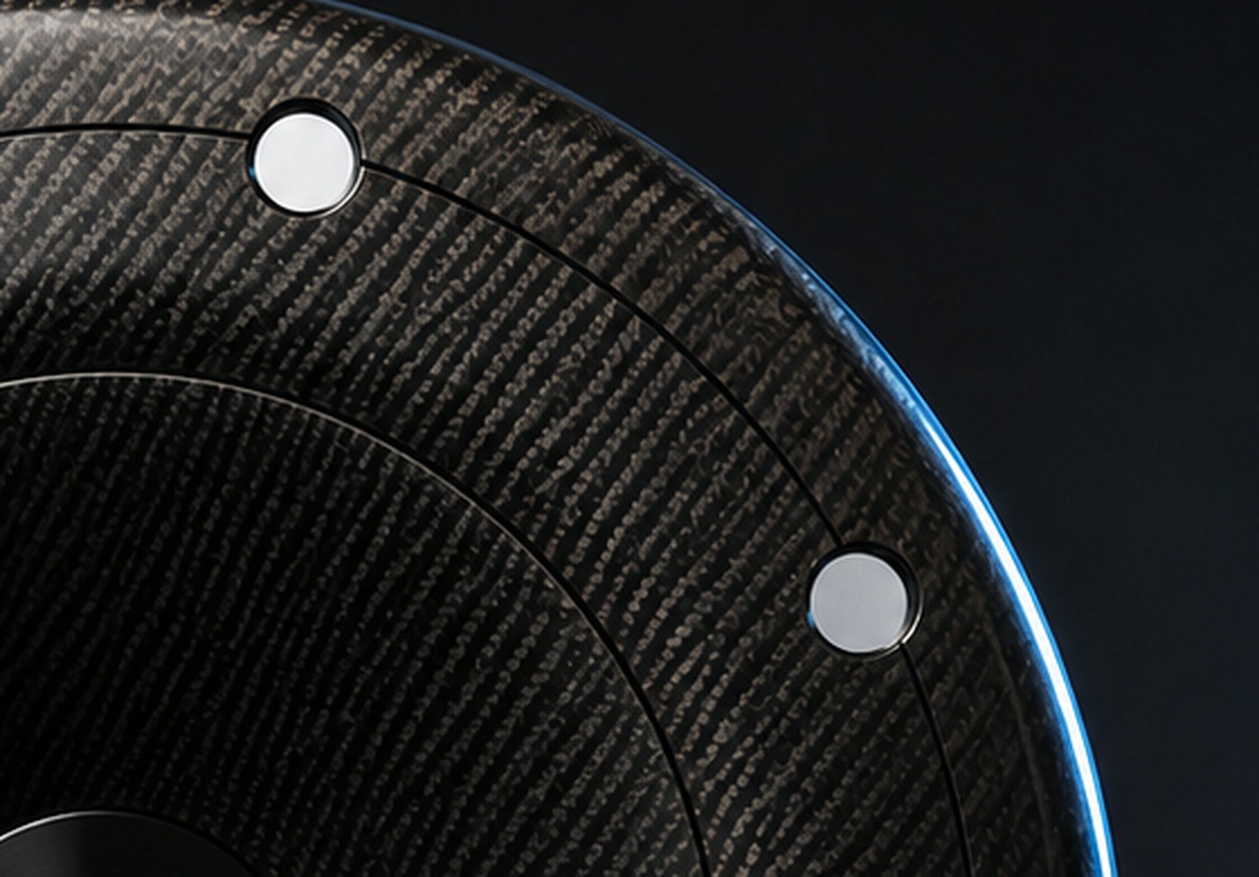 Detail of the AIRODISC carbon weave, a cooling port, and the rim edge